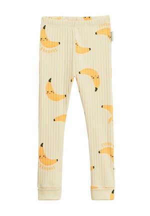 Dziecięce kremowe prążkowane legginsy z nadrukiem uśmiechającego się żółtego banana i elastycznym pasem.