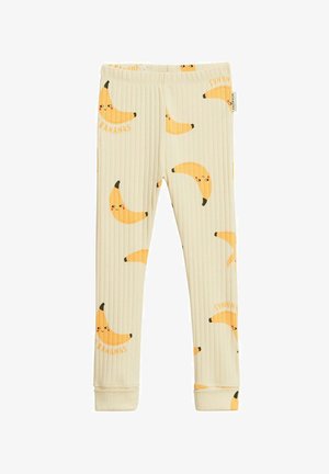 Kinder ribgebreide crèmekleurige legging met glimlachende gele banaanprint en elastische tailleband.