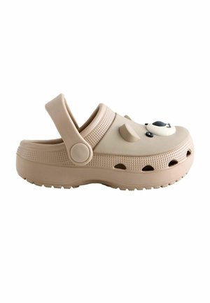 Beige casual clog with ventilation holes, adjustable back strap, and a panda face decoration on the upper front.