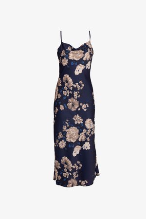 Marinebloemige slipdress met spaghettibandjes. Bevat grote beige en blauwe bloemen op een gladde, lichte stof. Zijslitdetail.