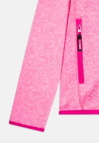 Fleece jacket in bright pink with a textured finish, featuring a contrasting pink zipper and cuffs. Includes a side zipper pocket.