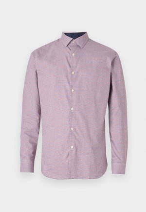 Raudonas ir laivyno mėlynumo langeliais margintas marškinėlių mygtukų modelis su ilgomis rankovėmis, aiškiai apibrėžtu apykakle ir šiek tiek prigludusia siluetu. Savybė - perlų tipo mygtukai.