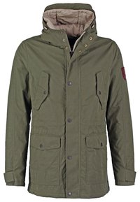 Olive green jacket with a zip and snap-button closure, two front pockets, adjustable hood, and a fabric shoulder patch. Textured fabric.