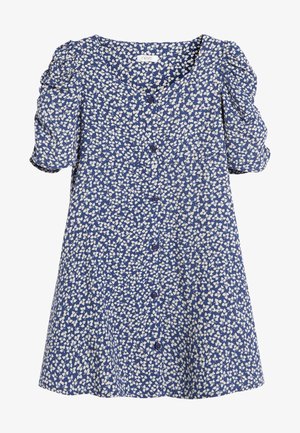 Modré květinové šaty s nafouklými rukávy, včetně výstřihu do V, předních knoflíků a volného střihu. Bílý listový vzor po celém látkovém povrchu.