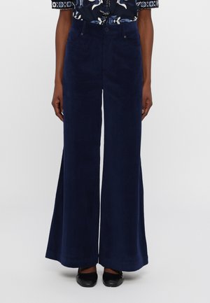 Navyblaues Cordhosen-Midihose mit hohem Bund und weitem Bein, ausgestattet mit zwei Vordertaschen, einem Knopfverschluss und einer glatten Textur.