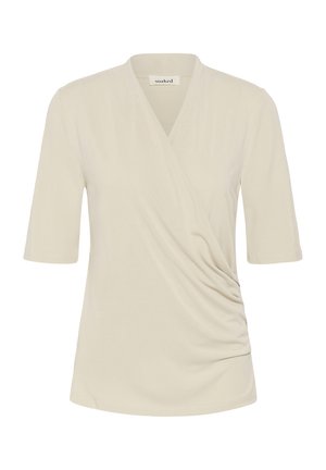 Kremkrāsas īss piedurknēm blūze ar V-veida izgriezuma apvijas dizainu un vieglu savākumu labajā priekšējā pusē.