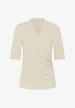 Kremkrāsas īss piedurknēm blūze ar V-veida izgriezuma apvijas dizainu un vieglu savākumu labajā priekšējā pusē.