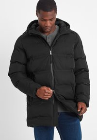 Black insulated puffer jacket featuring a hood, front zip closure, and quilted design. Material appears smooth with a matte finish.