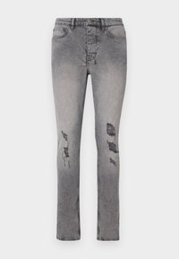 Hallide denimehed, kitsas lõige ja kerge venivusega. Omab kulunud plekke põlvedel ning klassikalist viit taskut.