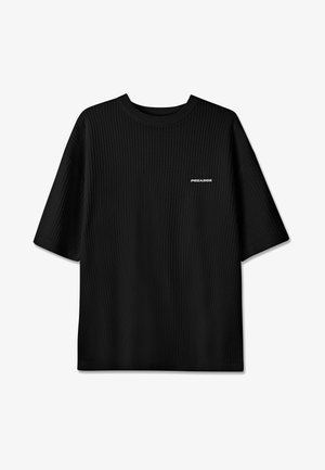 Black ribbed short-sleeve sweater with round neckline and small white "PEGADOR" logo on the left chest.