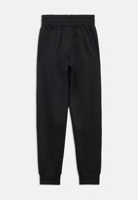 Black sweatpants with a stretchy, elastic waistband and tapered cuffs. Made from a smooth material, featuring no visible patterns or accents.