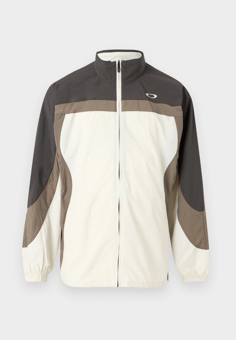 Letjacket i hvid og mørk taupe, med en høj krave, frontlynlås, elastiske manchetter og buede designfunktioner.