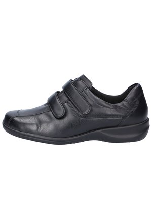 Black leather shoe with two Velcro straps, rounded toe, and a cushioned sole for comfort. Smooth texture with subtle stitching details.