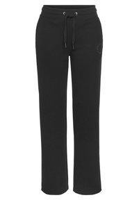 Schwarze Jogginghose aus weichem Stoff, mit elastischem Bund und verstellbaren Kordeln sowie einem diskreten Logo an dem linken Bein.