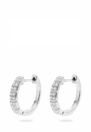 Silver hoop earrings featuring a row of clear, round gemstones. Smooth, polished surface with a segmented design, enhancing texture.