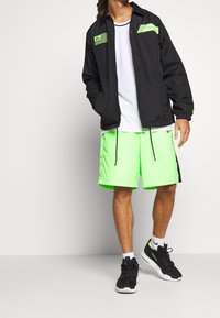 New Era Träningsjacka - black