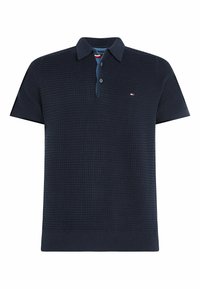 Marinblå polo med strukturerad stickad mönster, korta ärmar och klassisk krage. Har en treknäpps knäppning och diskret logotypdetalj.