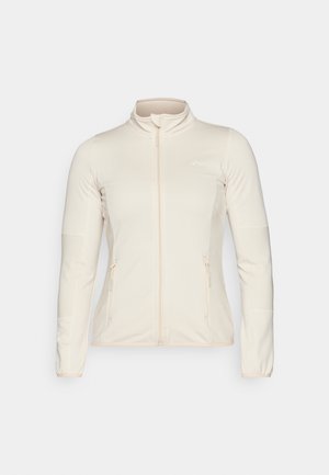 Lys beige zip-jakke med lange ermer, teksturerte sidepaneler og to frontlommer med glidelås. Rektangulært stoff med flatterende passform.