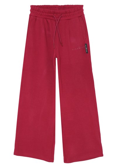 Pantaloni della tuta larghi e rossi realizzati in un tessuto morbido. Presentano una vita elasticizzata con coulisse e una stampa del logo sulla gamba sinistra.