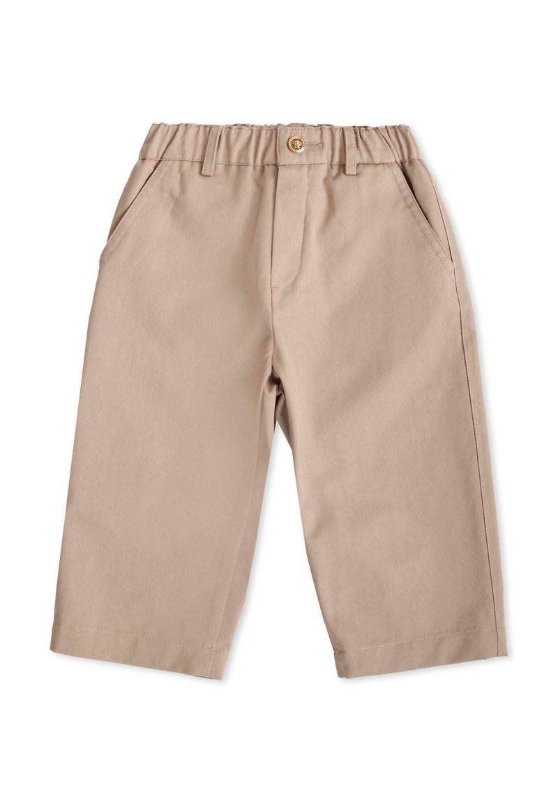 Beżowe, lekkie spodnie bawełniane z elastycznym pasem, detalem w postaci guzika, dwoma bocznymi kieszeniami i prostym krojem nogawki. Gładka faktura.