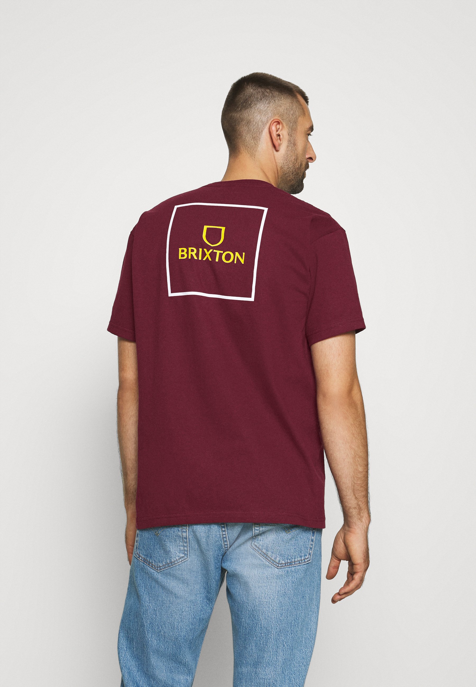 maroon shirt with white print