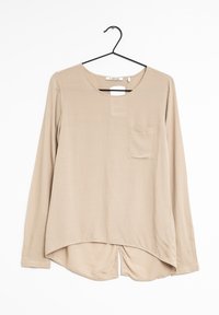 Beige Langarmbluse aus glattem Stoff, mit rundem Halsausschnitt, einer vorderen Tasche und einem geschwungenen Saum mit Seitenschlitzen.