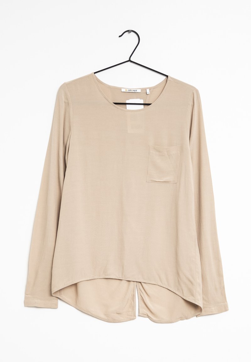 Beige langærmet bluse lavet af glat stof, med rund halsudskæring, en forlommer og en buet kant med sideslids.