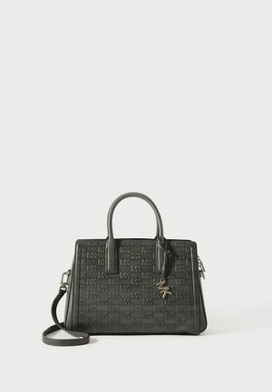 Dark green leather handbag with embossed MK logo, double top handles, removable shoulder strap, zip closure, and metal charm accent.