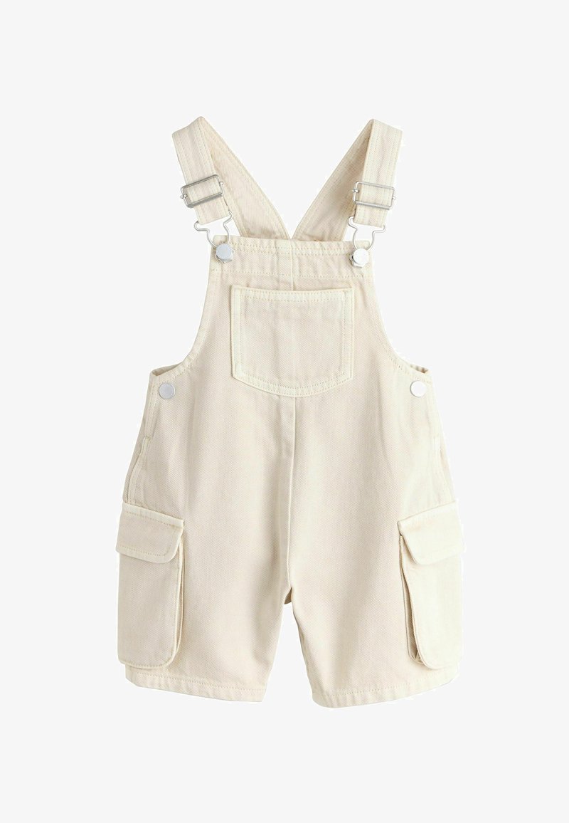 Salopetă pentru copii în culoarea crem, cu bretele reglabile, buzunar frontal pe piept și buzunare laterale cu clapetă, pe fundal alb.