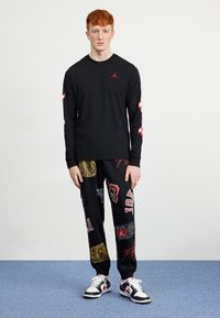 Jordan Pantalones deportivos - black/sail