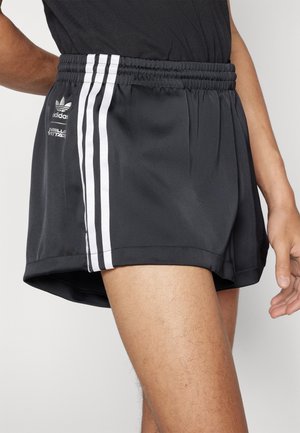 Black athletic shorts with a waistband, featuring three white side stripes and an Adidas logo. Made from smooth, lightweight material.