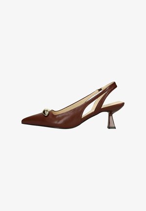 Brown leather slingback shoes with a pointed toe, an elegant cut-out design, and a small, block heel. Features a round metallic accent.