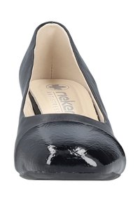 Black women's flat shoe with shiny toe cap, rounded front, and beige cushioned insole branded "Rieker Antistress."