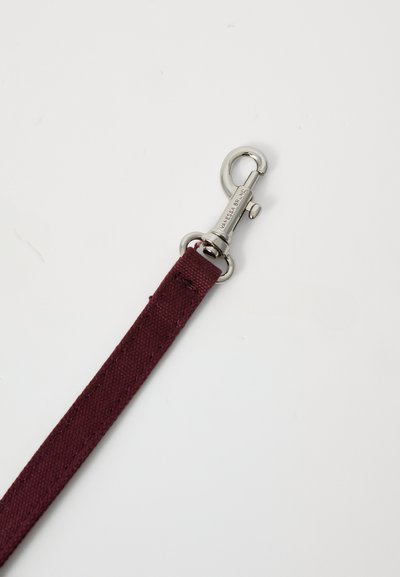 Burgundy fabric leash featuring a silver metal clip. The texture is smooth with visible stitching along the edges.