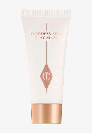 Tube en plastique blanc avec un fond rose gold. Inscription "GODDESS SKIN CLAY MASK" en lettres rose gold. Texture lisse, design minimaliste.