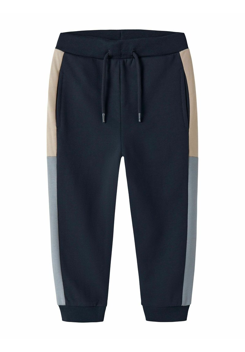 Navy jogger pants with beige and gray side panels, elastic waistband with drawstring, and ribbed cuffs at ankles.