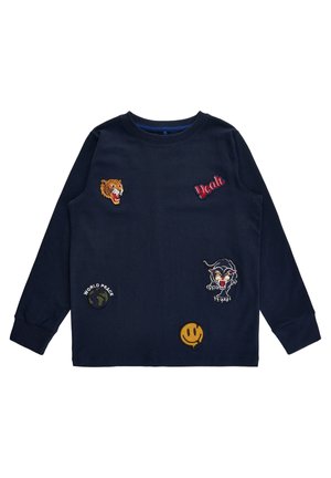 Granatowa koszula z długim rękawem z naszywkami, w tym ryczącym tygrysem, napisem "Yeah", czarną panterą, uśmiechniętą buźką i globusem z napisem "World Peace".