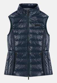 Mornarsko moder brezrokavnik iz quilted materiala z visokim ovratnikom, sprednjim zadrgo, dvema žepoma z zadrgo in horizontalnimi šivi.