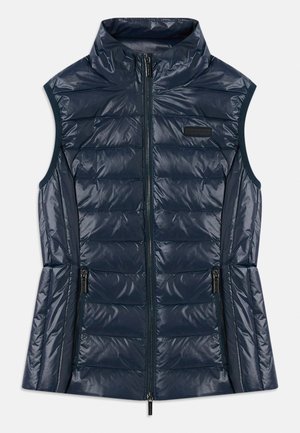 Navy blue sleeveless quilted puffer vest with high collar, front zipper, two zippered pockets, and horizontal stitching details.