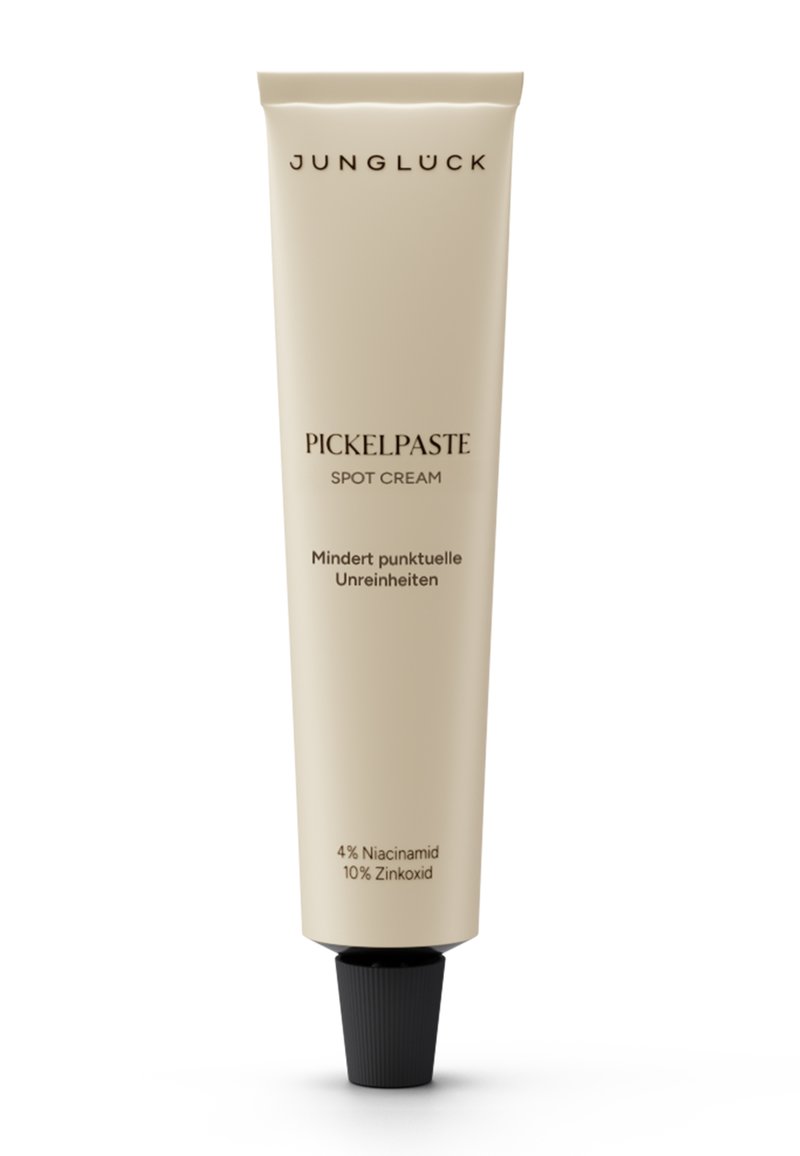 Beige squeeze tube with a black screw cap. Text on tube reads "Pickelpaste Spot Cream" and lists active ingredients like Niacinamide and Zinc Oxide.