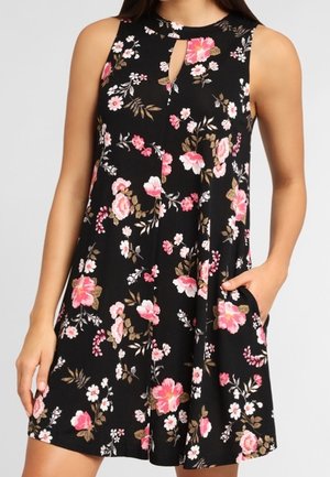 Kwiecista sukienka bez rękawów z czarnej tkaniny, zdobiona różowymi i białymi kwiatami, z dekoltem typu keyhole i bocznymi kieszeniami. Lekki i zwiewny fason.