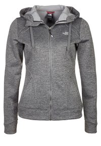 Šedá mikina na zip se kontrastní světle šedou kapucí, šňůrkami s kostkovaným vzorem a předními kapsami. Měkká, strukturovaná látka.