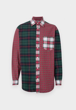 Checkered shirt featuring a mix of red and green plaid patterns, button-up front, long sleeves, and a chest pocket with a smaller plaid design.