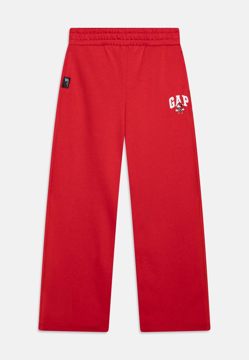 Rdeče trenirke z elastičnim pasom, ki vsebujejo bel logotip "GAP" in grafični znak na levi strani. Gladka bombažna tkanina, sproščen kroj.