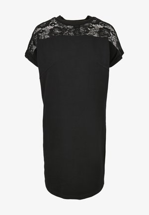 Zwarte jurk met een kanten paneel op de schouders, korte mouwen en een losse pasvorm. Zachte stof met een ronde halslijn en een ronde zoom.