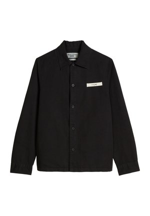Black long-sleeve button-up shirt with collar, front patch featuring small text, and label inside collar reading Marc O'Polo Denim.