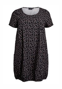 Schwarzes Kleid mit weißen Punkten, kurzen Ärmeln, rundem Ausschnitt und elastischem Saum. Besitzt große beigefarbene Punkte und eine lockere, lässige Passform.