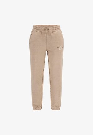 Bež jogger hlače s elastičnim pojasom, vezicom i suženim gležnjevima. Imaju diskretni logo na lijevom bedru. Glatka tekstura tkanine.