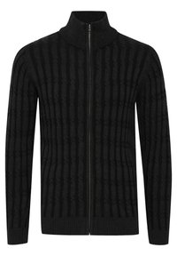 Black zippered sweater with a high collar, featuring a textured pattern of vertical stripes and ribbed cuffs and hem.