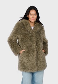 Faux fur coat in olive green, featuring a wide collar, long sleeves, and front pockets. Soft, textured material with a shaggy appearance.